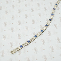 1920's white gold syn sapphire french cut and diamond line bracelet