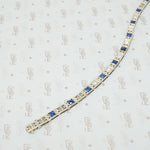 1920's white gold syn sapphire french cut and diamond line bracelet