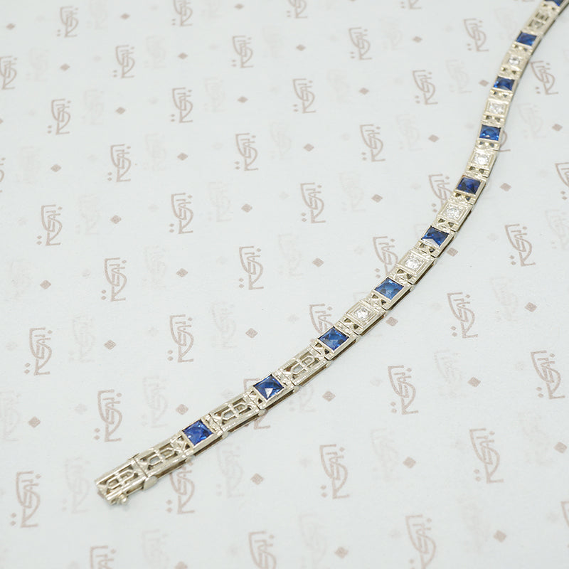 1920's white gold syn sapphire french cut and diamond line bracelet