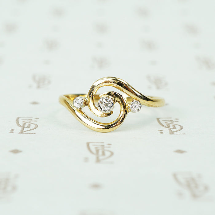 18k yellow gold swirl ring with tiny diamonds set in platinum french hallmarks