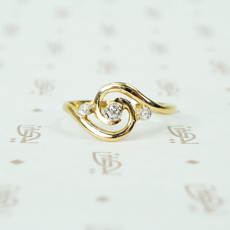 18k yellow gold swirl ring with tiny diamonds set in platinum french hallmarks