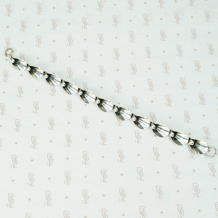 mid century ne from silver bracelet