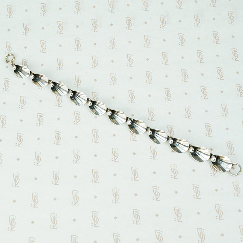 mid century ne from silver bracelet