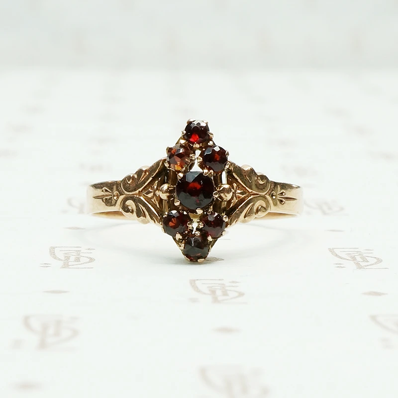 deep red garnets set in 12k rose gold victorian ring