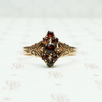 deep red garnets set in 12k rose gold victorian ring