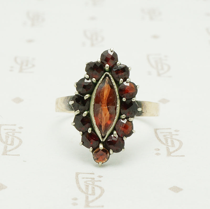 rose cut garnets in a vette shape with a gold band ring circa 1930