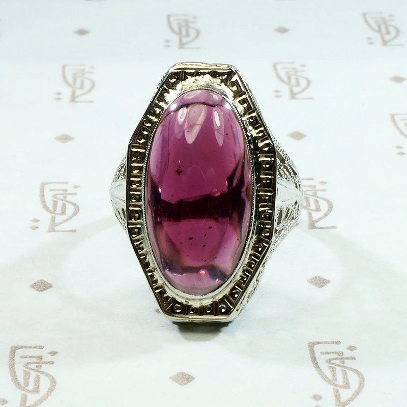 oval cabochon garnet translucent purplish red in 14k white gold filigree ring