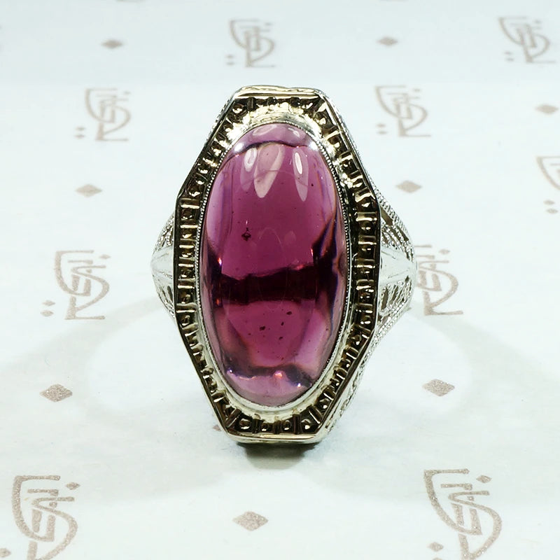 oval cabochon garnet translucent purplish red in 14k white gold filigree ring