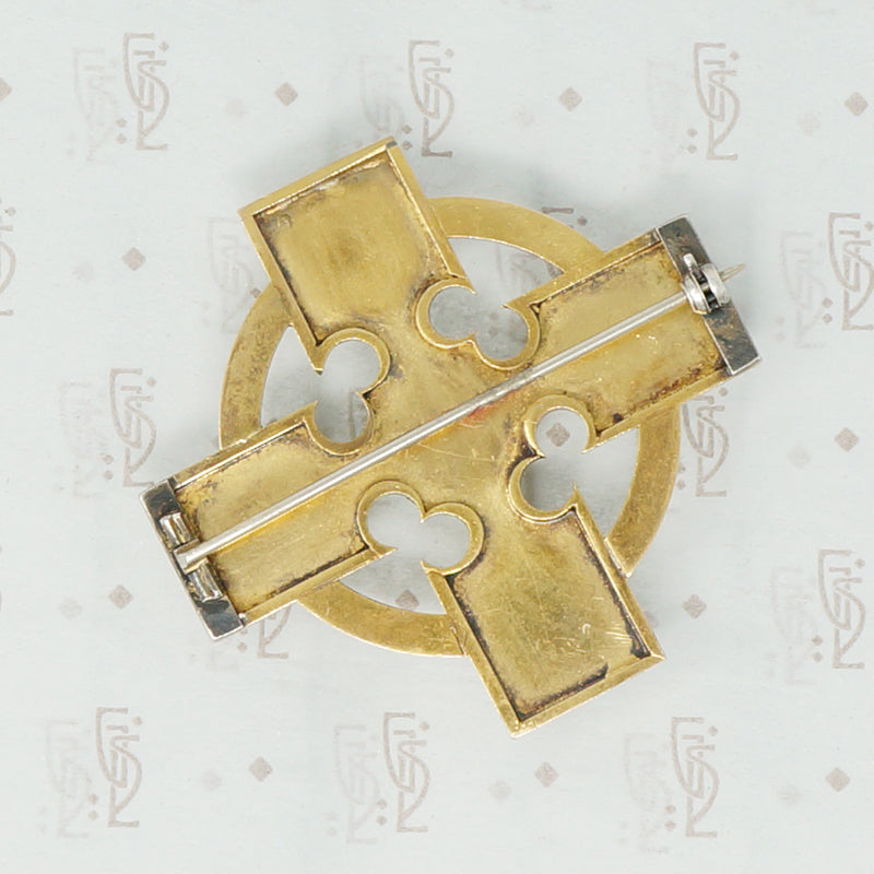 18k cross brooch set with garnet carbuncles
