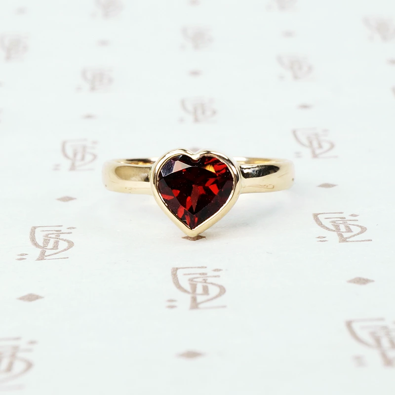 heart shaped garnet ring in 14k yellow gold recycled