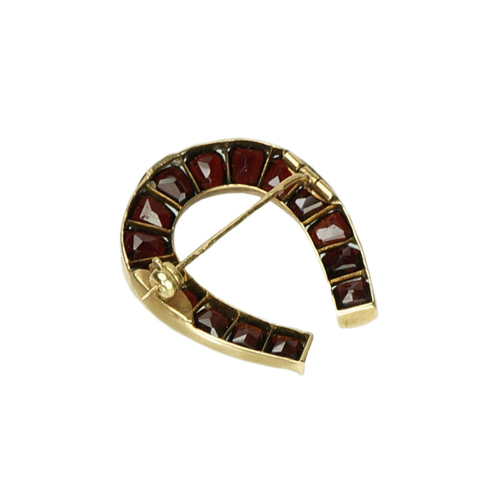 Antique Calibré Cut Garnet Horseshoe Brooch