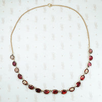 foiled closed back pinched collet flat cut garnet necklace