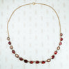 foiled closed back pinched collet flat cut garnet necklace