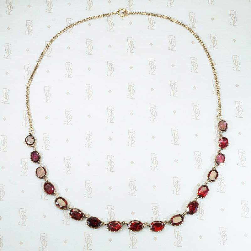 foiled closed back pinched collet flat cut garnet necklace