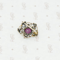 Gold brooch with acanthus leaves a rhodolite garnet and pearls back view