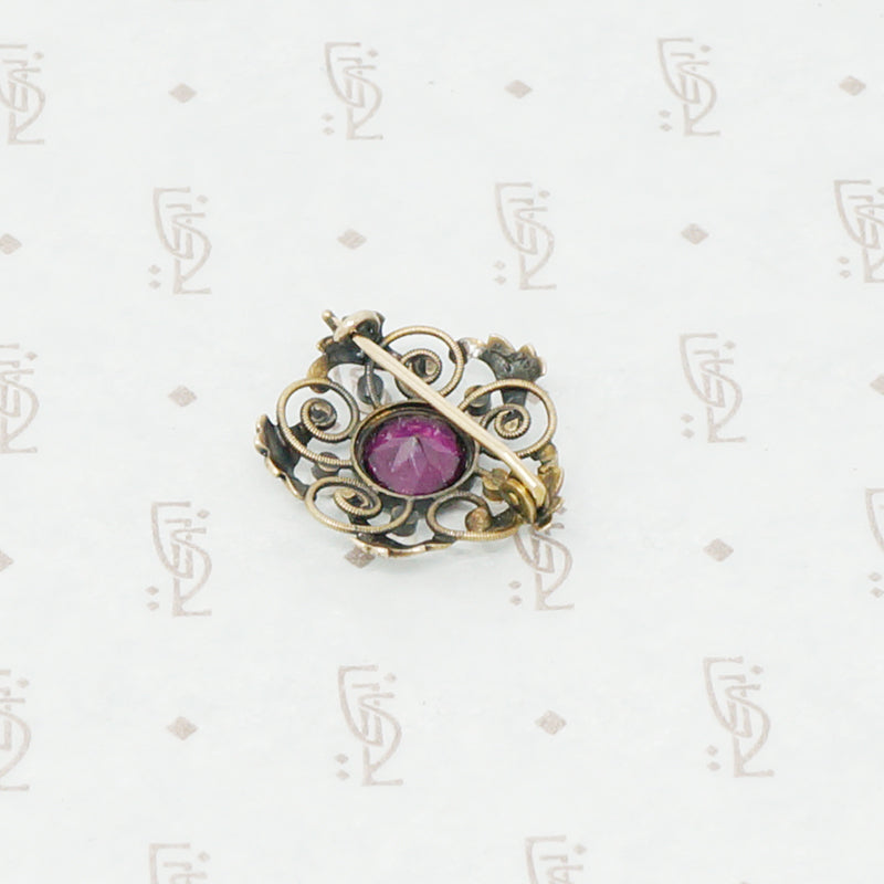 Gold brooch with acanthus leaves a rhodolite garnet and pearls back view