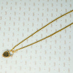 georgian heart lock locket back with garnet carbuncle on gold chain showing crystal cove on back