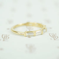 .94carats of vvs/vs f/g baguette diamonds in 14k yellow gold band side view diamonds set horizontally