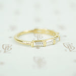 .94carats of vvs/vs f/g baguette diamonds in 14k yellow gold band side view diamonds set horizontally