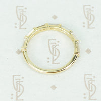 flat side view of 7 diamond baguette band in recycled 14k yellow gold