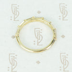 flat side view of 7 diamond baguette band in recycled 14k yellow gold