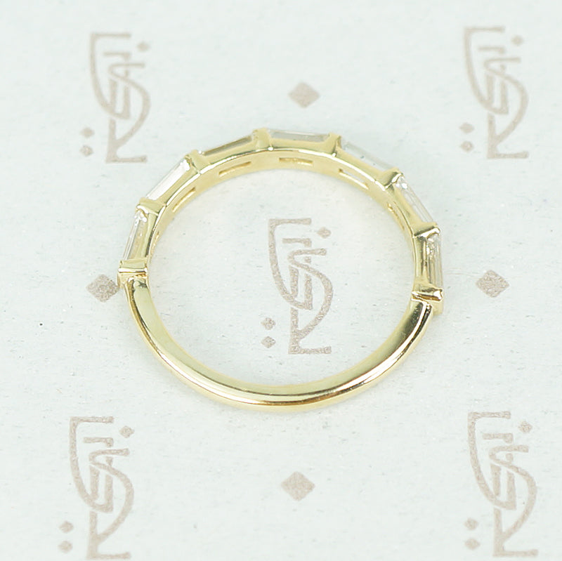 flat side view of 7 diamond baguette band in recycled 14k yellow gold