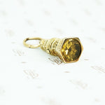 9ct fob with yellow glass stone