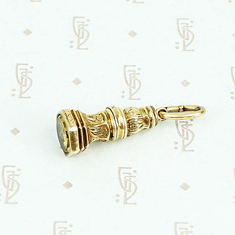 9ct fob with yellow glass stone