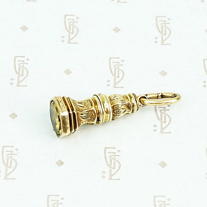 9ct fob with yellow glass stone