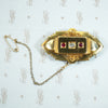 15k English Locket back brooch with original saety chain and omc diamond and rubies