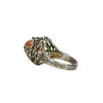 detail side view of floral 1960's sterling silver and goldstone ring
