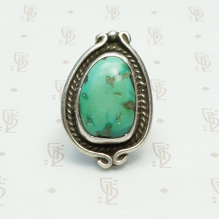 vintage 1970's green turquoise ring in coin silver with a snake like frame design, bold size