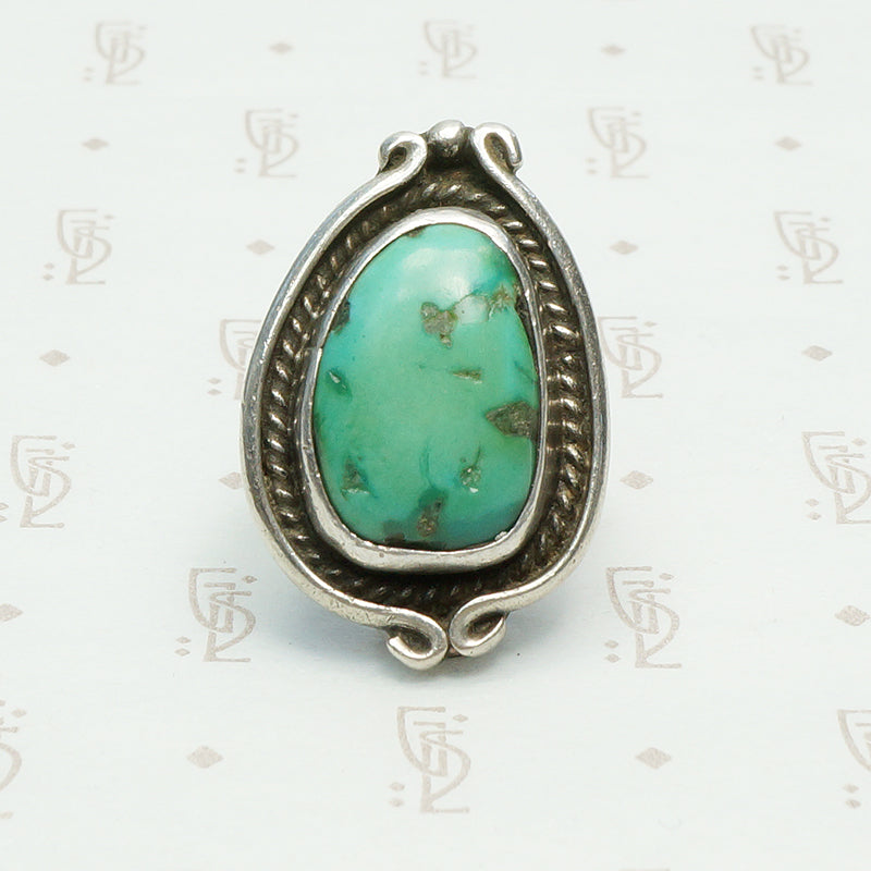 vintage 1970's green turquoise ring in coin silver with a snake like frame design, bold size