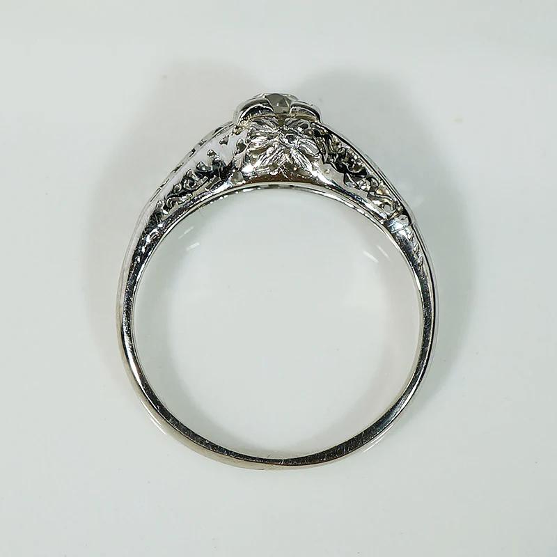 Ornate White Gold Solitaire Ring with Charming Old Diamond