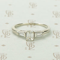 Refined Emerald Step-Cut Diamond Engagement Ring