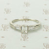 Refined Emerald Step-Cut Diamond Engagement Ring