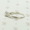 Refined Emerald Step-Cut Diamond Engagement Ring