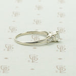 Refined Emerald Step-Cut Diamond Engagement Ring