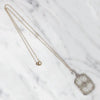 Lacy Filigree Framed Camphor Glass Necklace