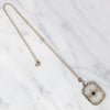 Lacy Filigree Framed Camphor Glass Necklace