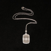 Lacy Filigree Framed Camphor Glass Necklace
