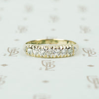low profile yellow and white gold diamond band