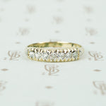 low profile yellow and white gold diamond band