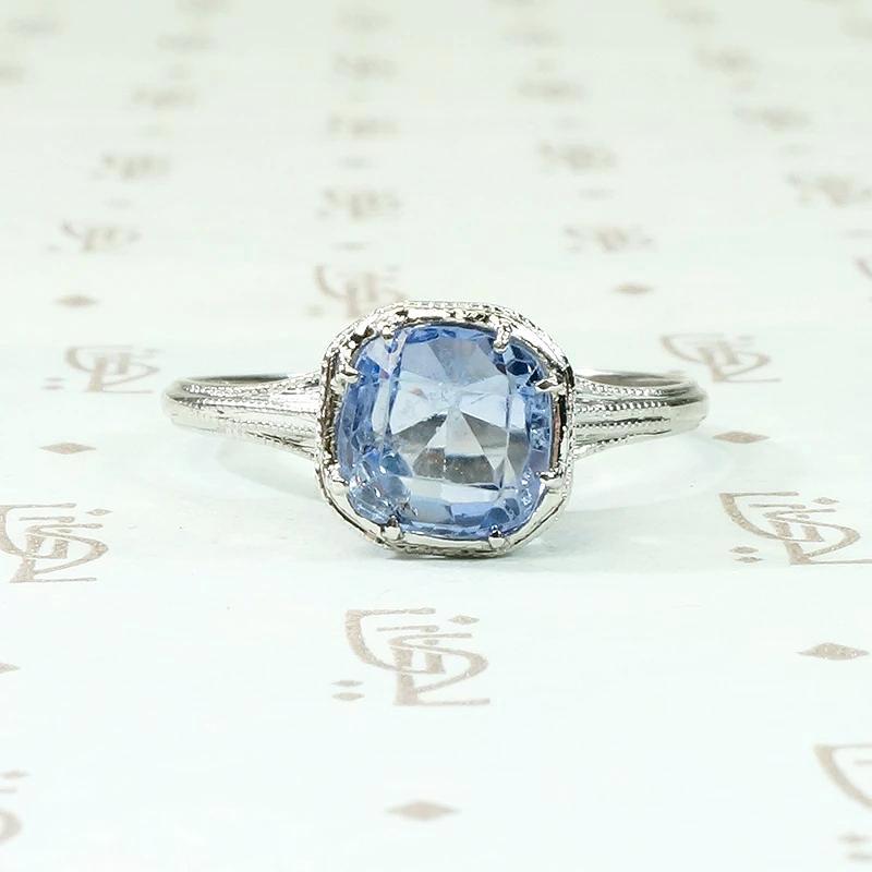 Engraved Platinum Solitaire Ring with Antique Sapphire