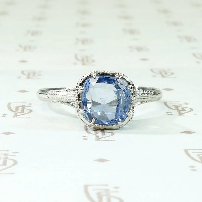 Engraved Platinum Solitaire Ring with Antique Sapphire