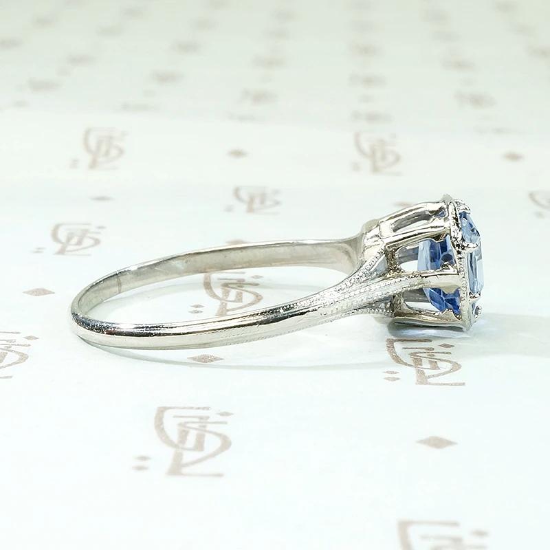 Engraved Platinum Solitaire Ring with Antique Sapphire