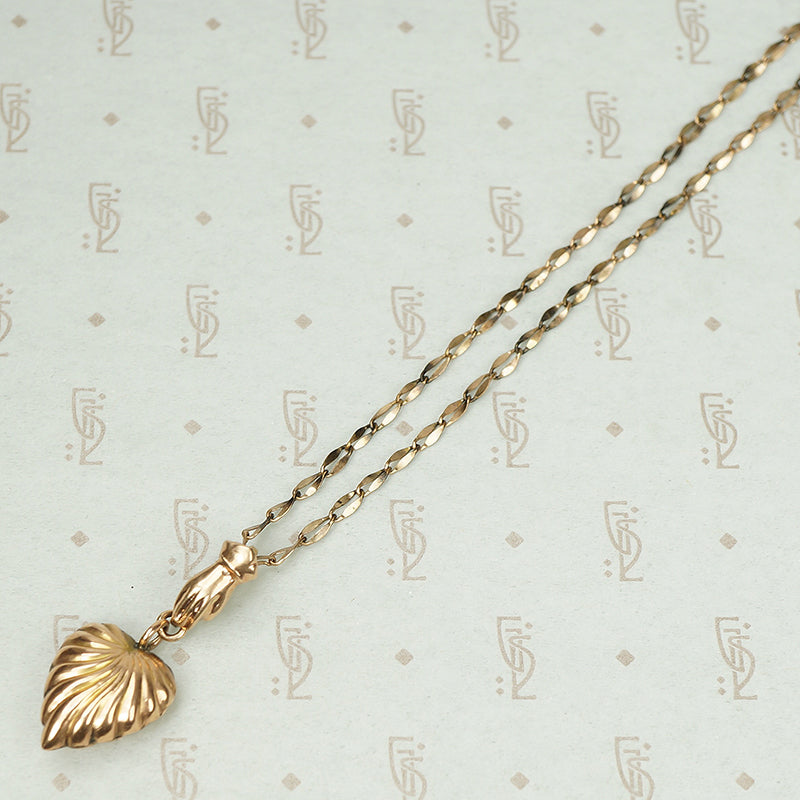 The Heart and Hand Necklace in Rose Gold