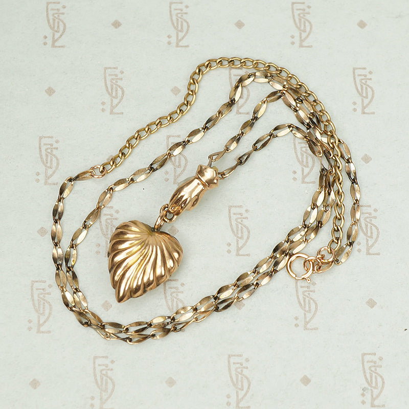 The Heart and Hand Necklace in Rose Gold