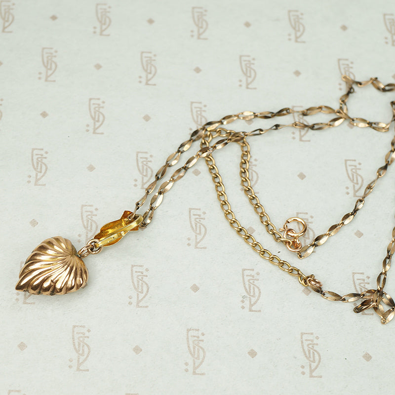 The Heart and Hand Necklace in Rose Gold