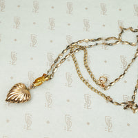 The Heart and Hand Necklace in Rose Gold